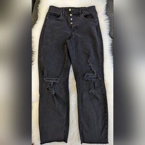 Black women's distressed jeans.